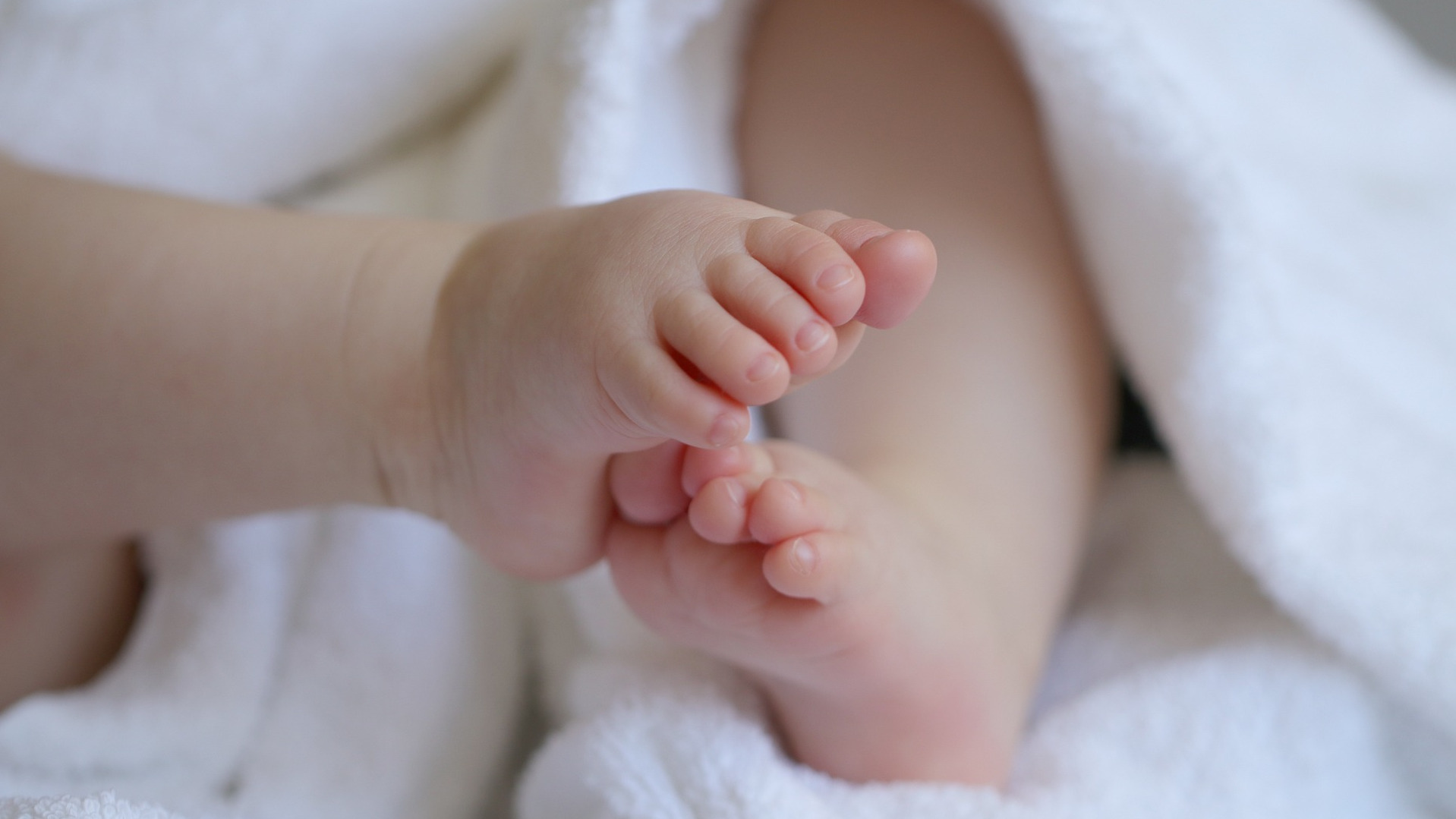 Baby feet in a cloth blanket