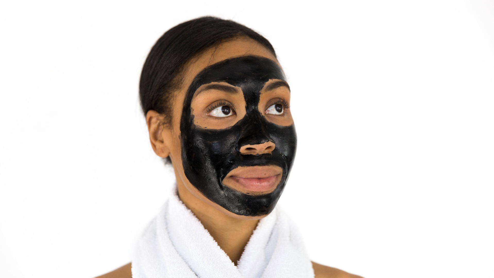 Woman with a charcoal facemask