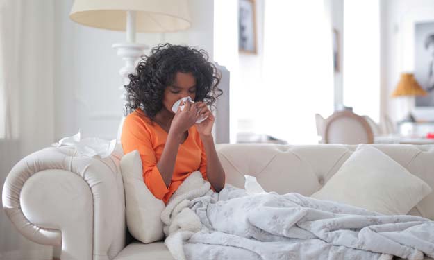 Young Woman with Cold. Home Remedies for Weakened Immune System.