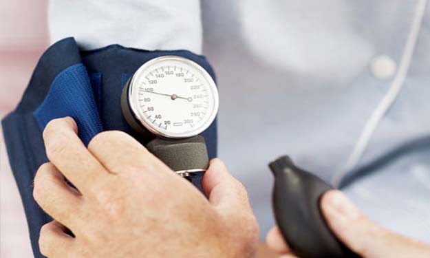 Doctor Checking Patients Blood Pressure.