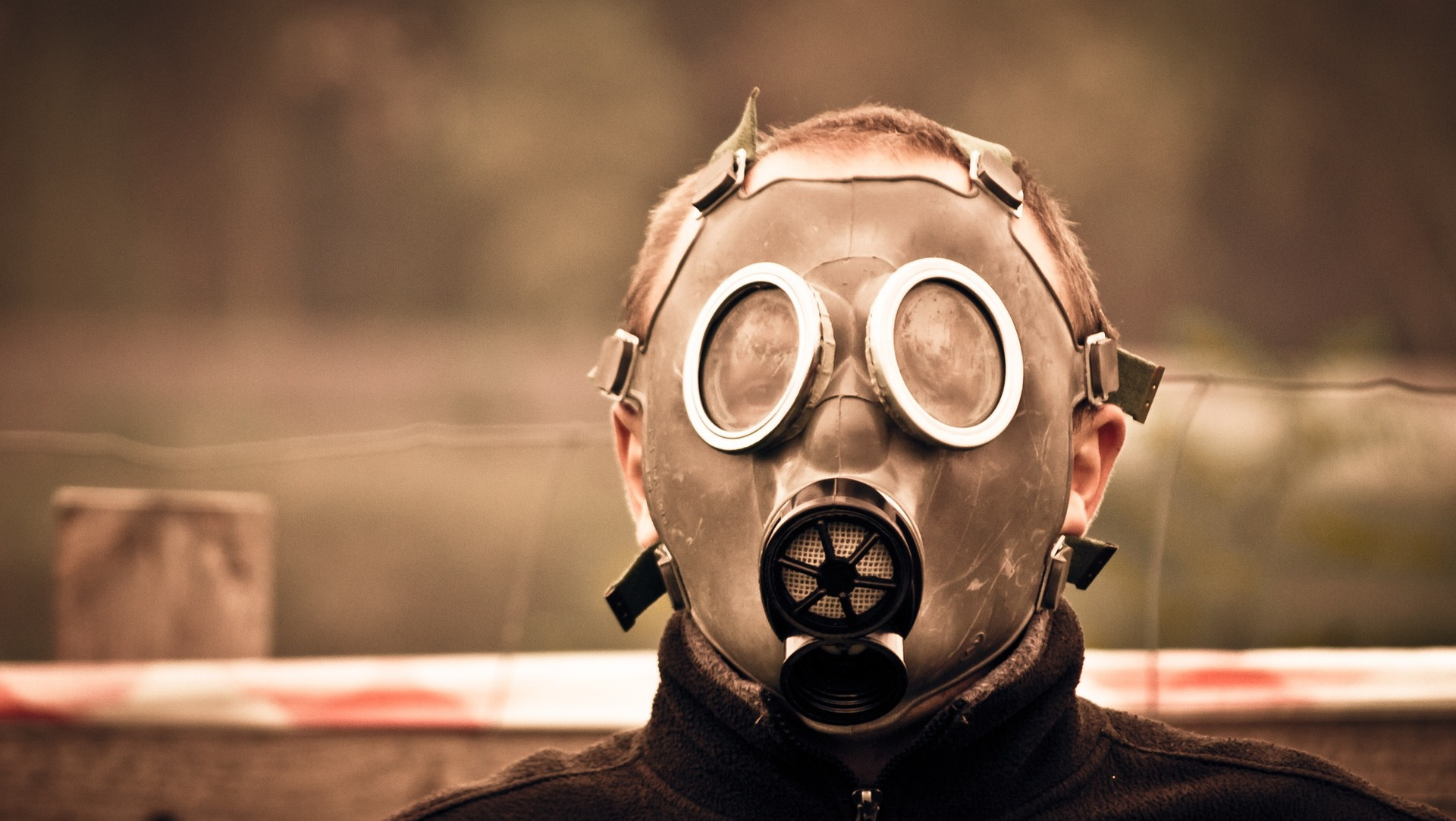 Man wearing a gas mask.