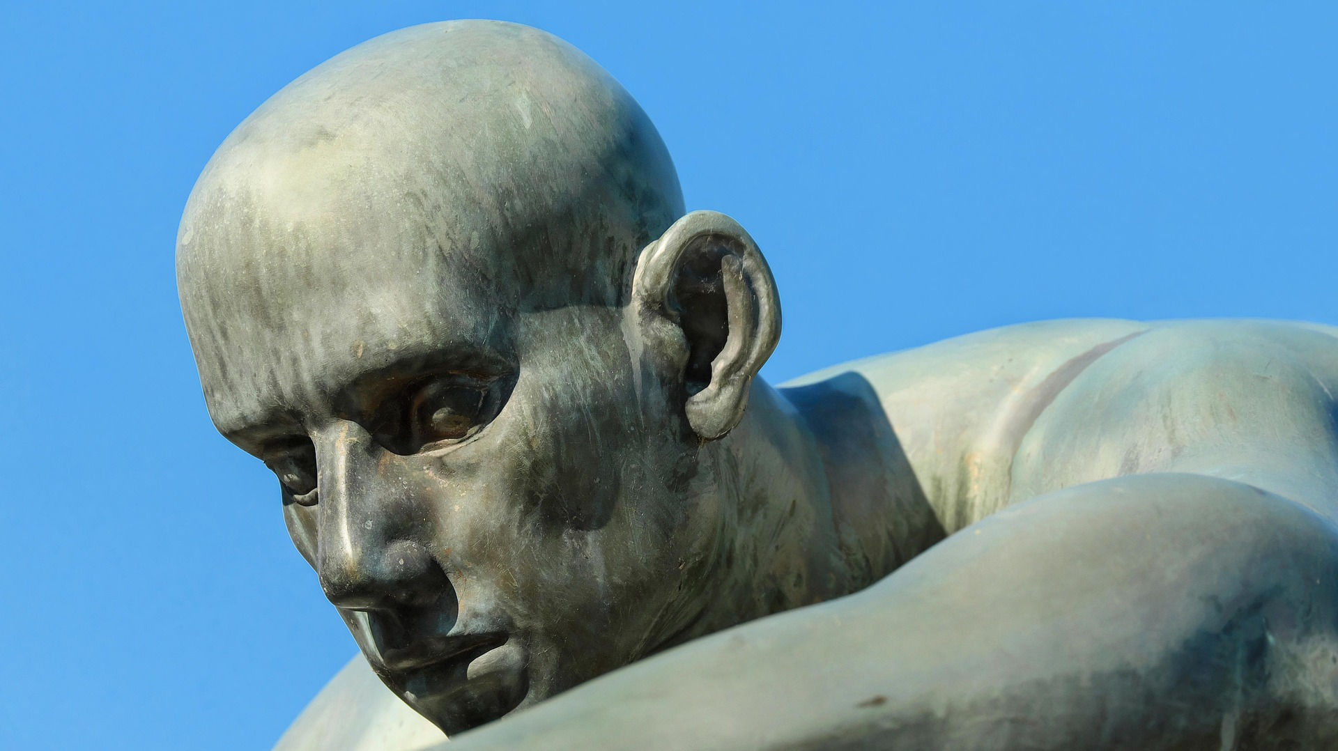 sculpture of bald headed man