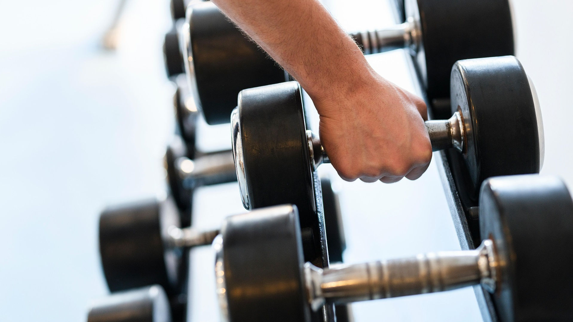mans hand lifting weight