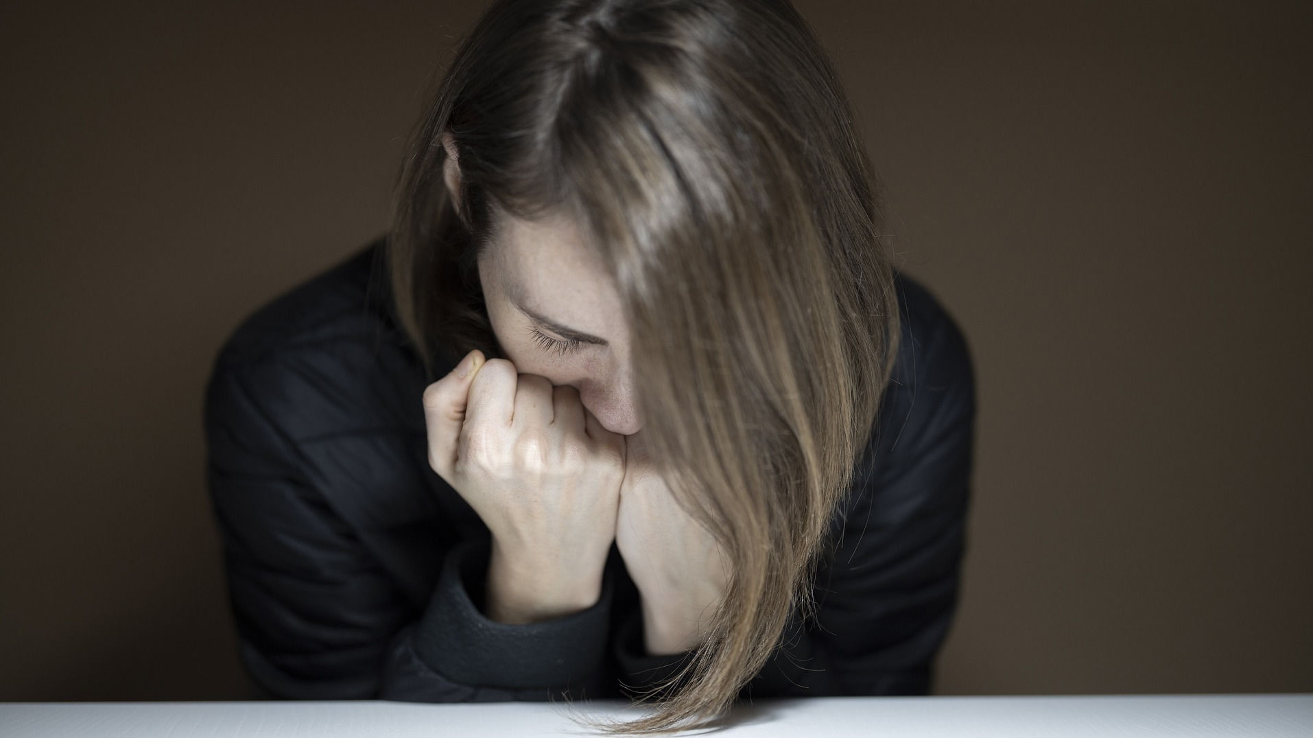 Fatigued woman in black shirt